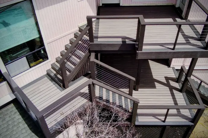 Stacked landings and stainless cable railing maximize views and usable space on a hillside lot. Composite decking, engineered framing, and safe transitions—Apex Exteriors’ multi-level deck solution for Tahoe and El Dorado County.