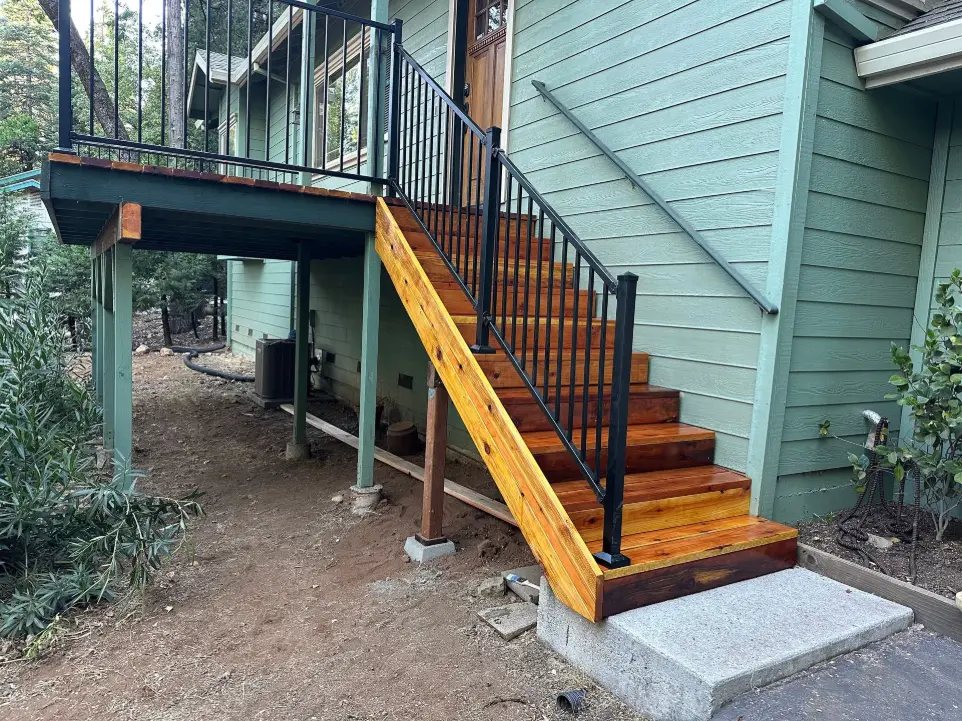 Apex Exteriors rebuilt this Camino/Placerville entry with cedar treads, black steel railing, and reinforced framing. A code-compliant, durable staircase that boosts curb appeal and safety for Sierra weather.